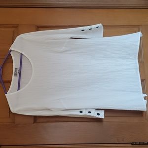 Ladies white tunic with black accent buttons on sleeves